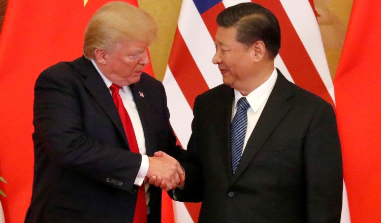 U.S. President Donald Trump and China's President Xi Jinping make joint statements at the Great Hall of the People in Beijing, China, November 9, 2017. REUTERS/Jonathan Ernst - RC1C68BB71F0